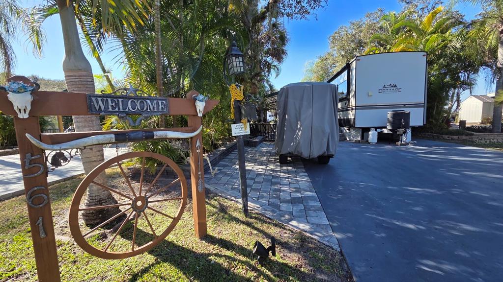 a view of a chairs and table in the backyard