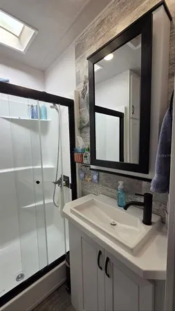 a bathroom with a sink and a mirror