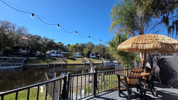 a view of a balcony with sitting area