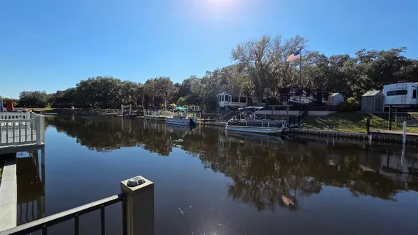 a view of a lake with houses in the back