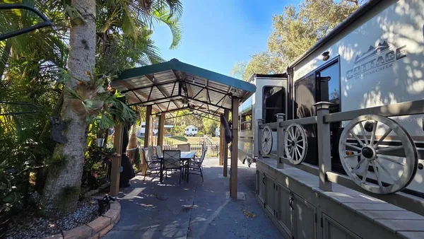 a view of a chairs and table in a patio