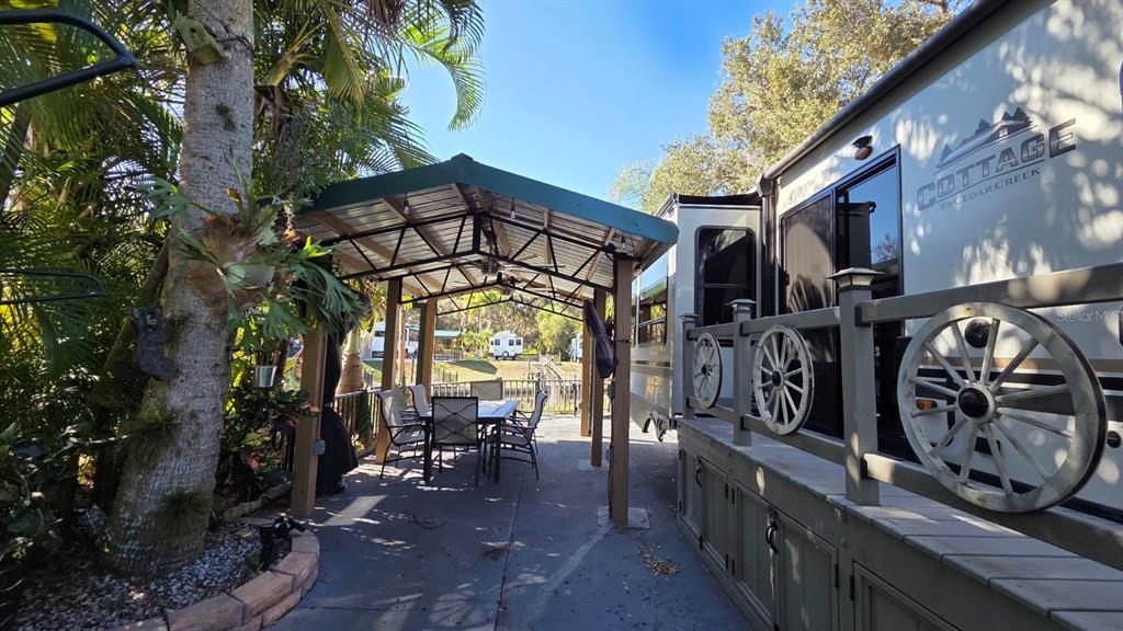 561 Waterway Drive River Ranch, FL 33867 - Photo 7 of 18 a view of a chairs and table in a patio