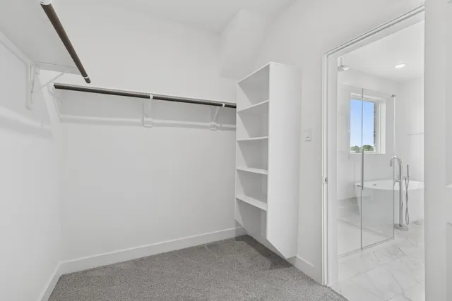 a view of an empty walk in closet