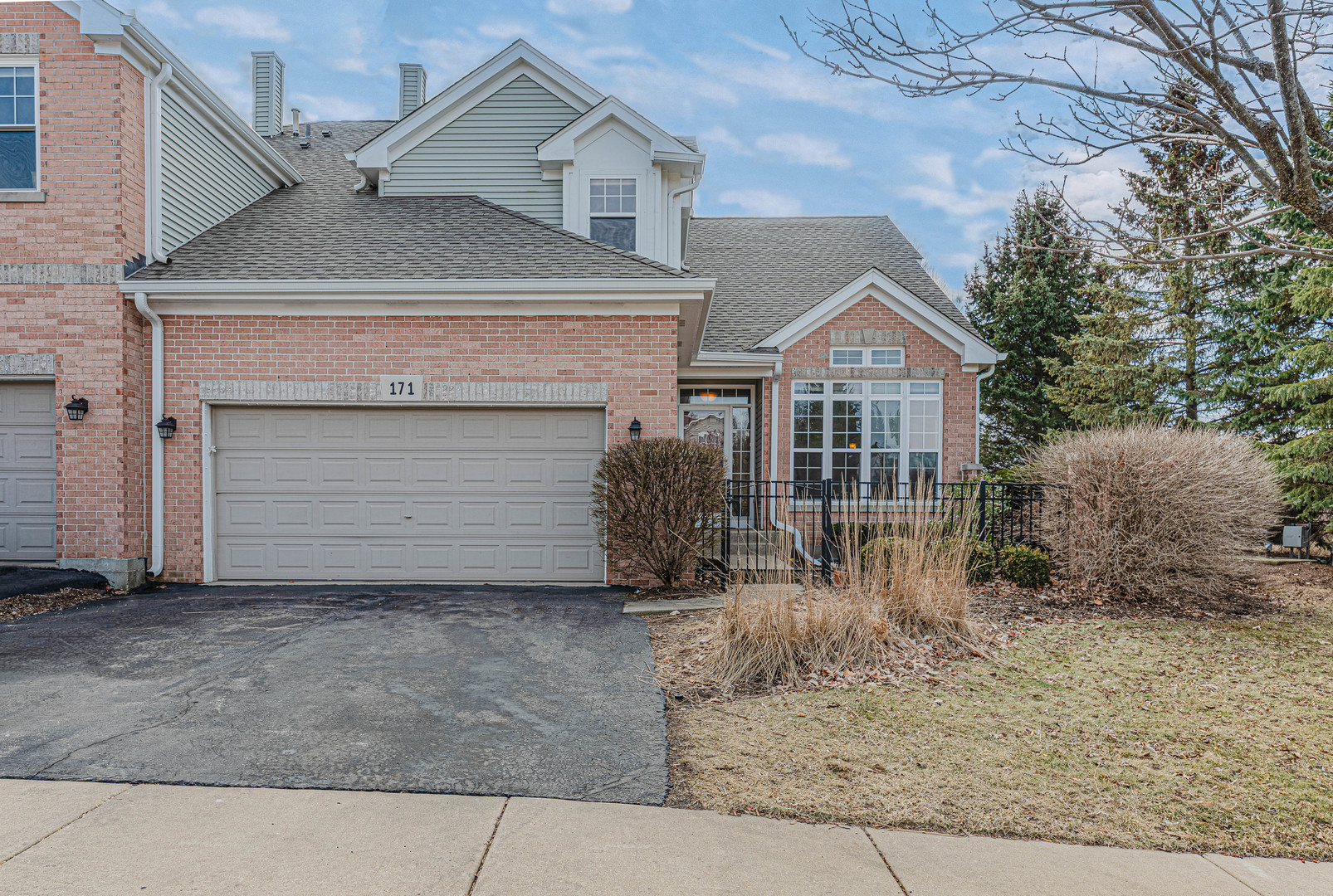 171 Partridge Lane Bartlett, IL 60103 - Photo 1 of 34 a front view of a house with a yard and garage