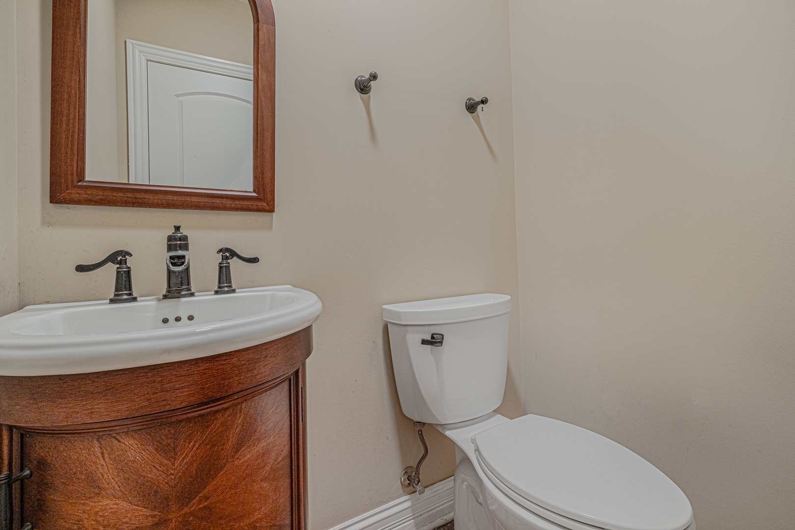 171 Partridge Lane Bartlett, IL 60103 - Photo 16 of 34 a bathroom with a toilet a sink and mirror