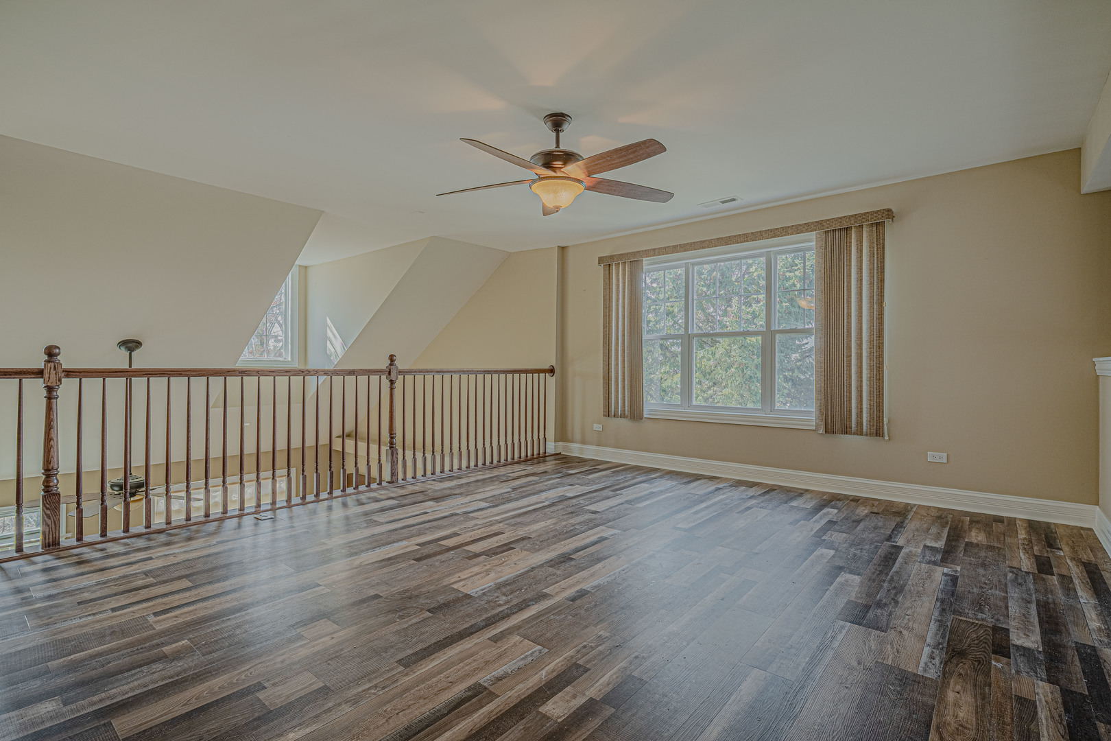171 Partridge Lane Bartlett, IL 60103 - Photo 17 of 34 wooden floor in an empty room with a window