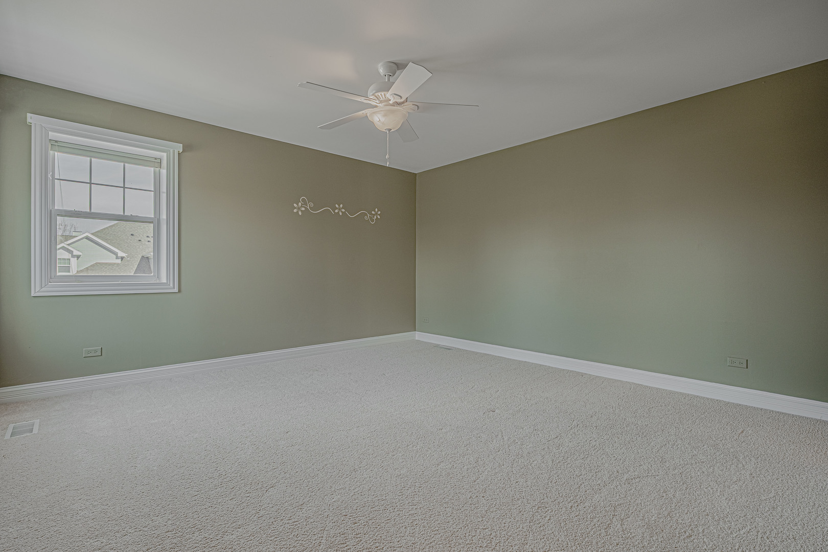 171 Partridge Lane Bartlett, IL 60103 - Photo 19 of 34 an empty room with a chandelier fan and windows