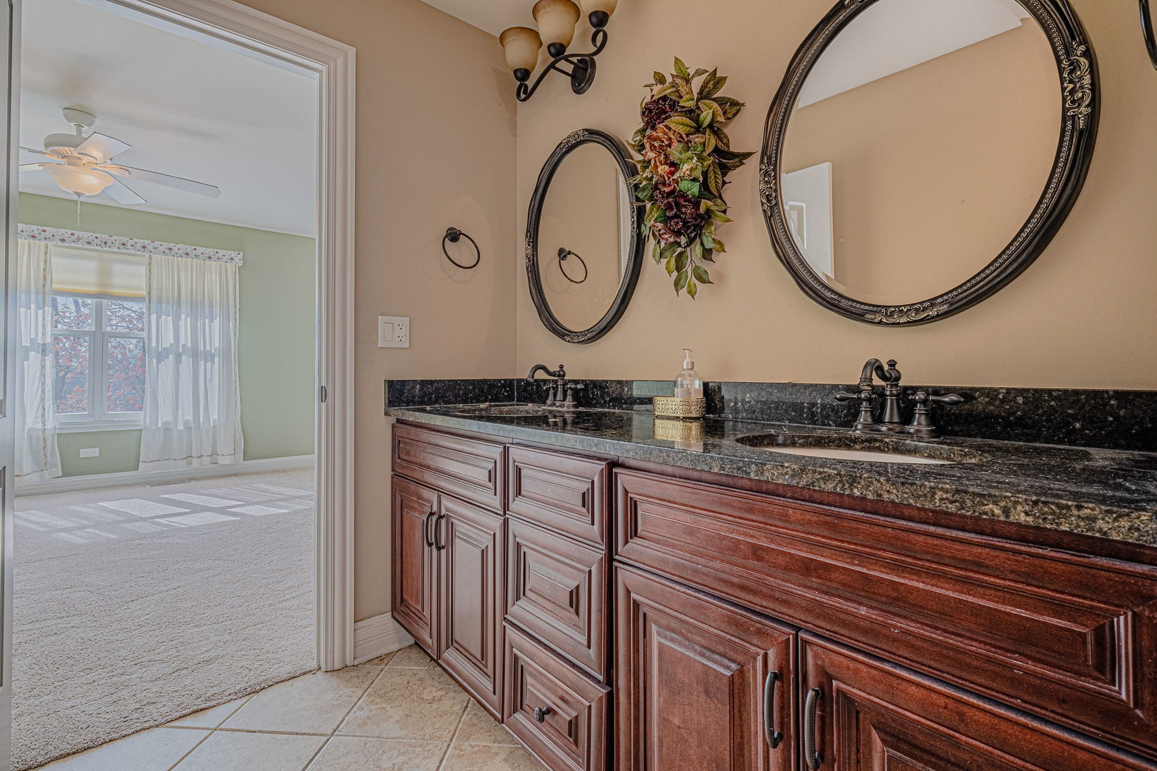 171 Partridge Lane Bartlett, IL 60103 - Photo 21 of 34 a bathroom with a granite countertop double vanity sink and a mirror