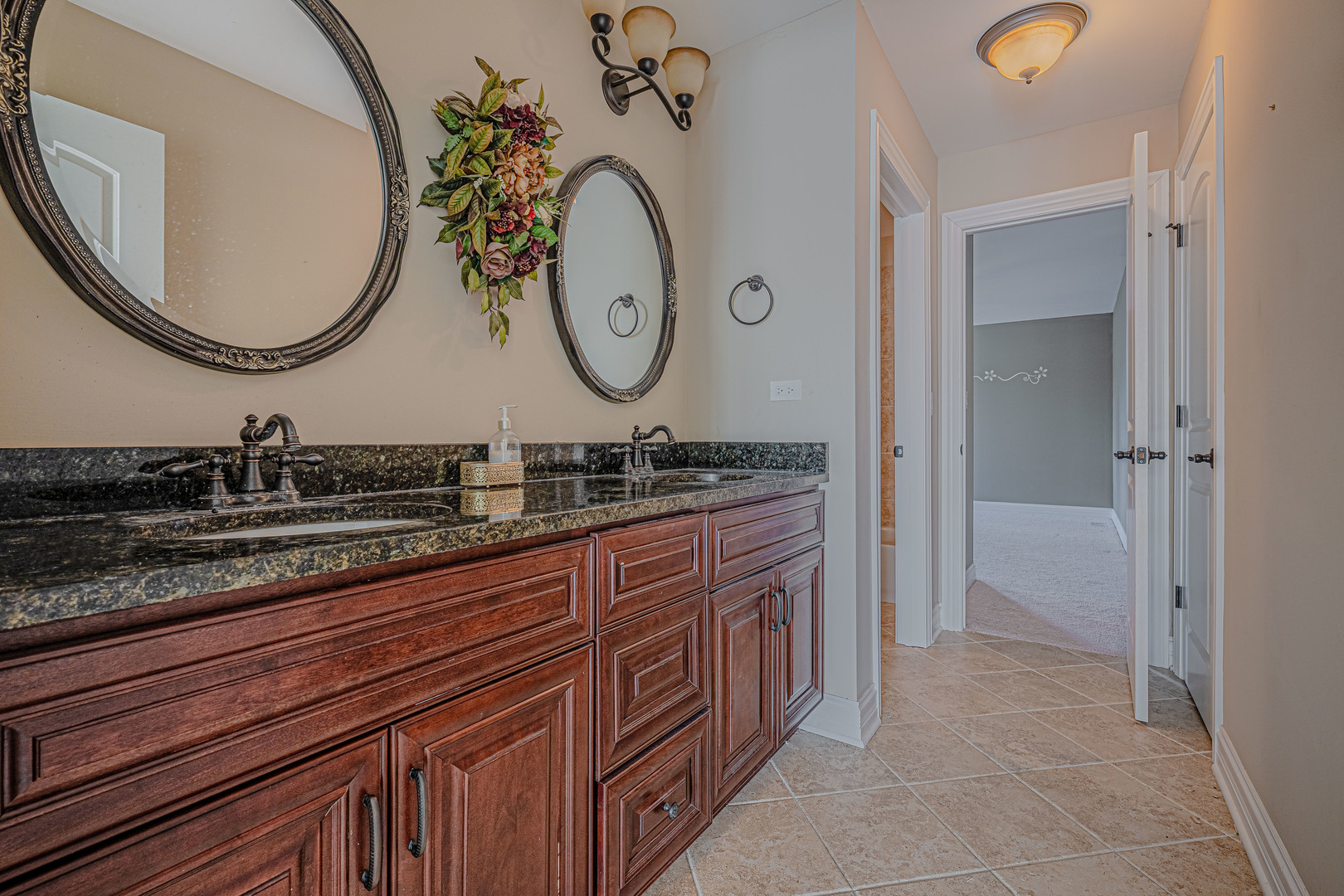 171 Partridge Lane Bartlett, IL 60103 - Photo 22 of 34 a bathroom with a granite countertop double vanity sink and a mirror