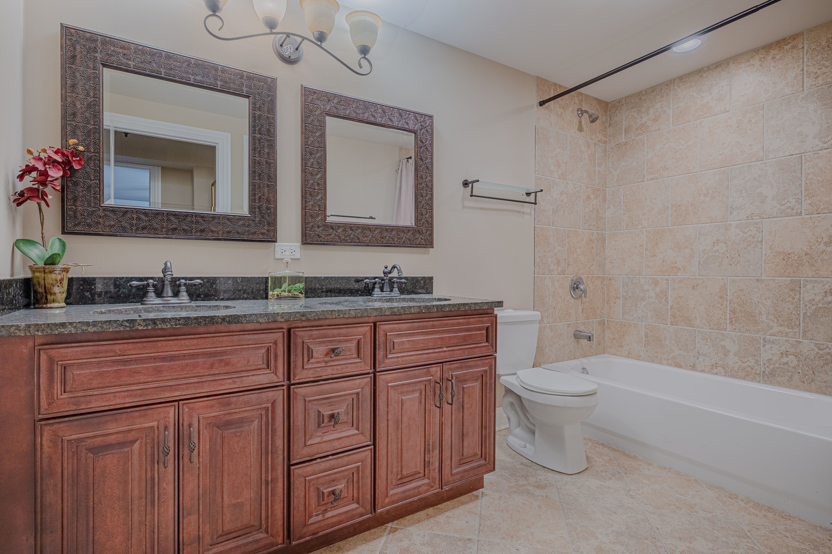 171 Partridge Lane Bartlett, IL 60103 - Photo 29 of 34 a bathroom with a granite countertop toilet sink and mirror
