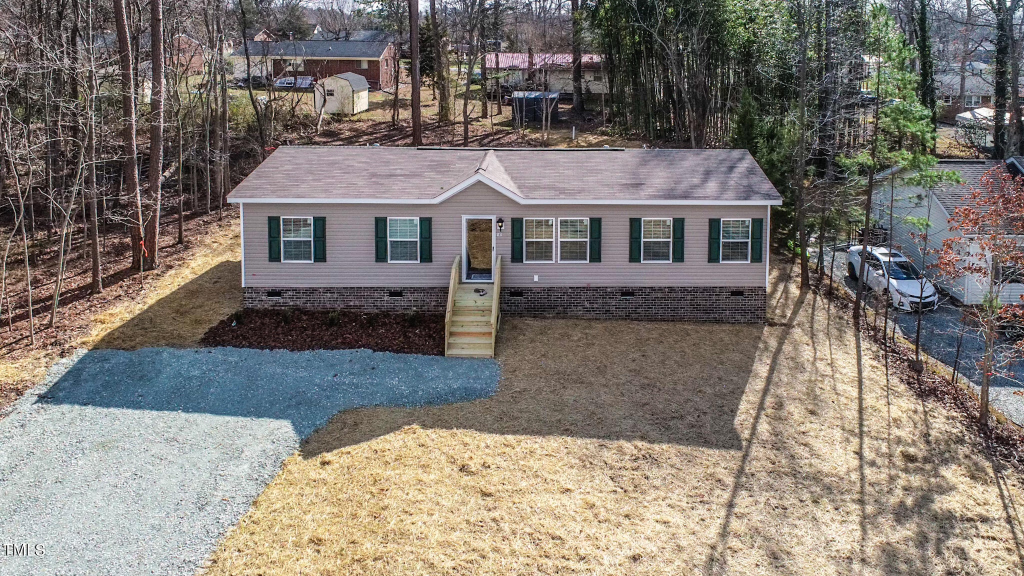 107 Azalea Drive Roxboro, NC 27573 - Photo 1 of 43 a front view of a house with a yard