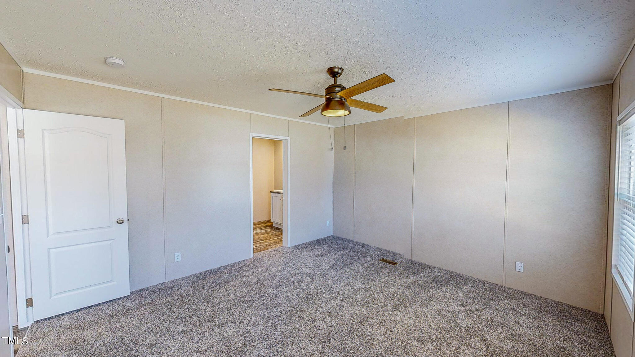 107 Azalea Drive Roxboro, NC 27573 - Photo 17 of 43 a view of a livingroom with a ceiling fan