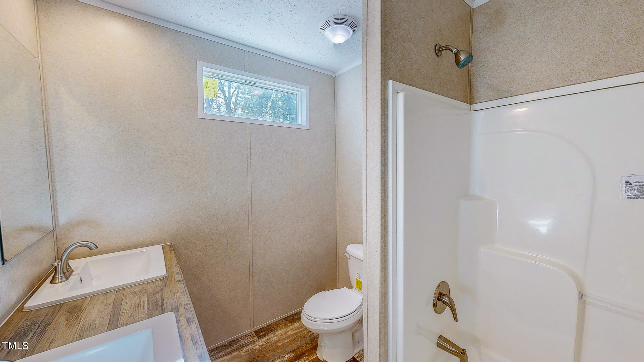 107 Azalea Drive Roxboro, NC 27573 - Photo 36 of 43 a bathroom with a sink a toilet and shower