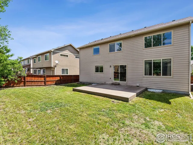 a view of a backyard with tree s