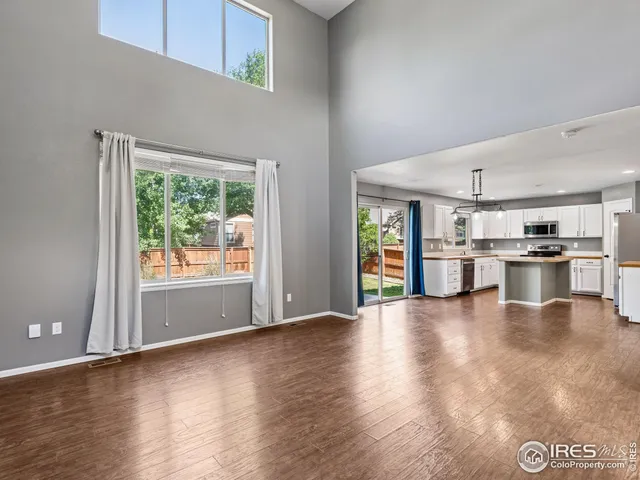 a view of kitchen with furniture and wooden floor