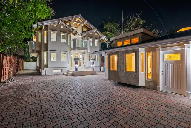 a view of a patio with a table and chairs