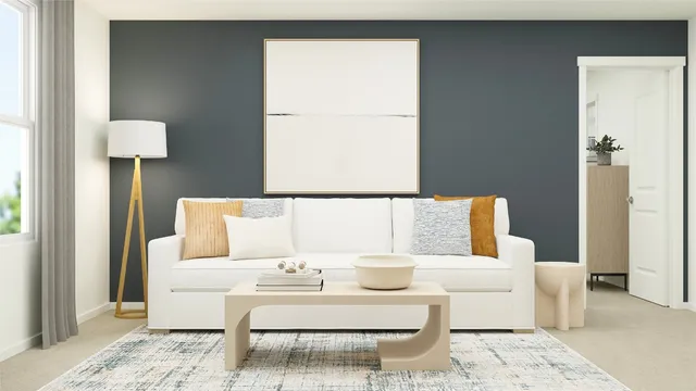 a living room with furniture and a lamp