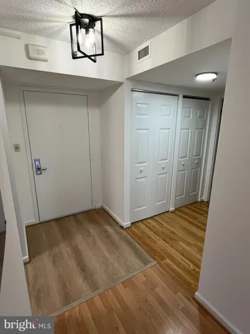 a kitchen with stainless steel appliances a refrigerator and cabinets