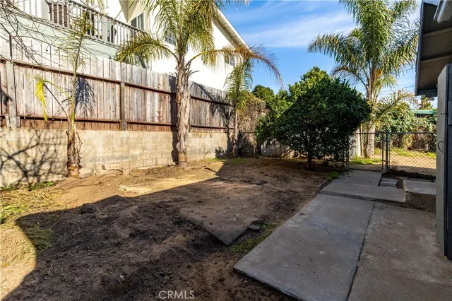 a view of a backyard of the house