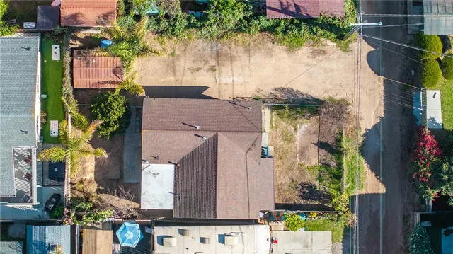 aerial view of multiple houses with yard