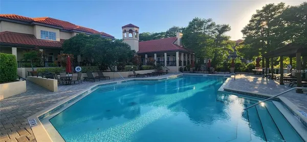 a view of a swimming pool with a patio