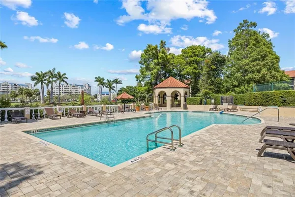 a swimming pool with outdoor seating yard and livingroom