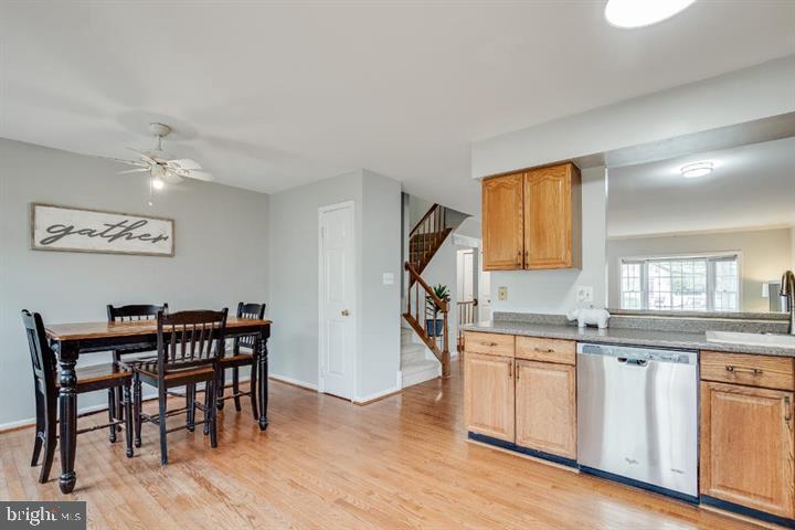 21186 Winding Brook Square Ashburn, VA 20147 - Photo 16 of 42 a kitchen with a table and chairs in it