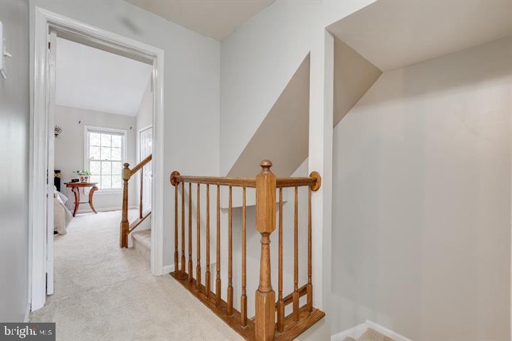 21186 Winding Brook Square Ashburn, VA 20147 - Photo 23 of 42 a view of a hallway view with staircase