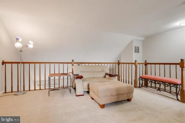 a bedroom with furniture and a flat screen tv