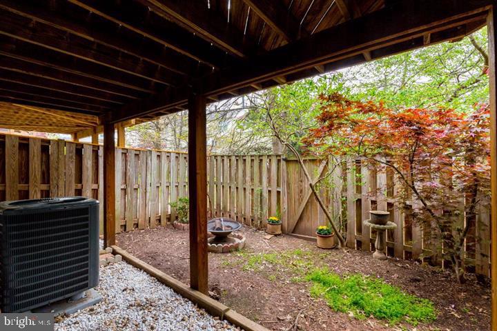 21186 Winding Brook Square Ashburn, VA 20147 - Photo 35 of 42 a view of a backyard with table and chairs