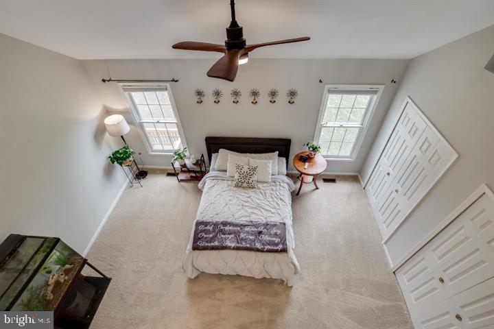 21186 Winding Brook Square Ashburn, VA 20147 - Photo 36 of 42 a living room with furniture and a fireplace