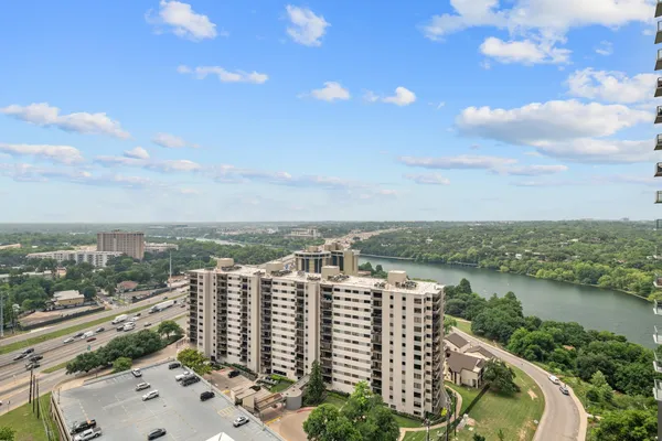 a view of a lake with building in front of it