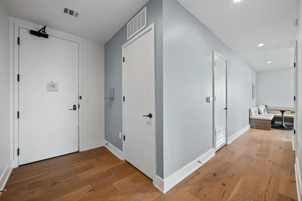 a view of an empty room and a bedroom