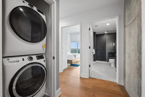 a view of a hallway with washer and dryer