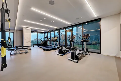 a view of a gym with gym equipment