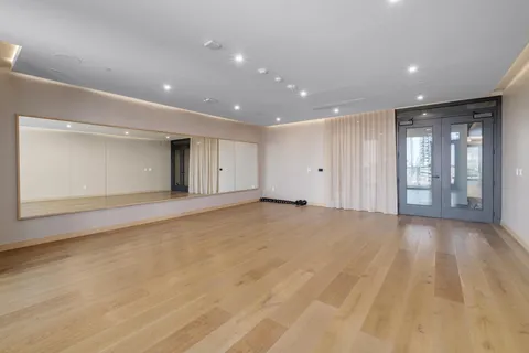 a view of an empty room with glass door
