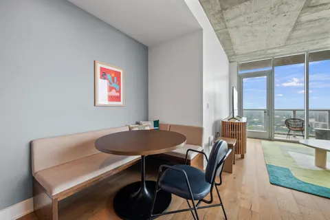 a view of a dining room with furniture window and outside view