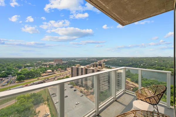 a view of a city from a balcony with city view