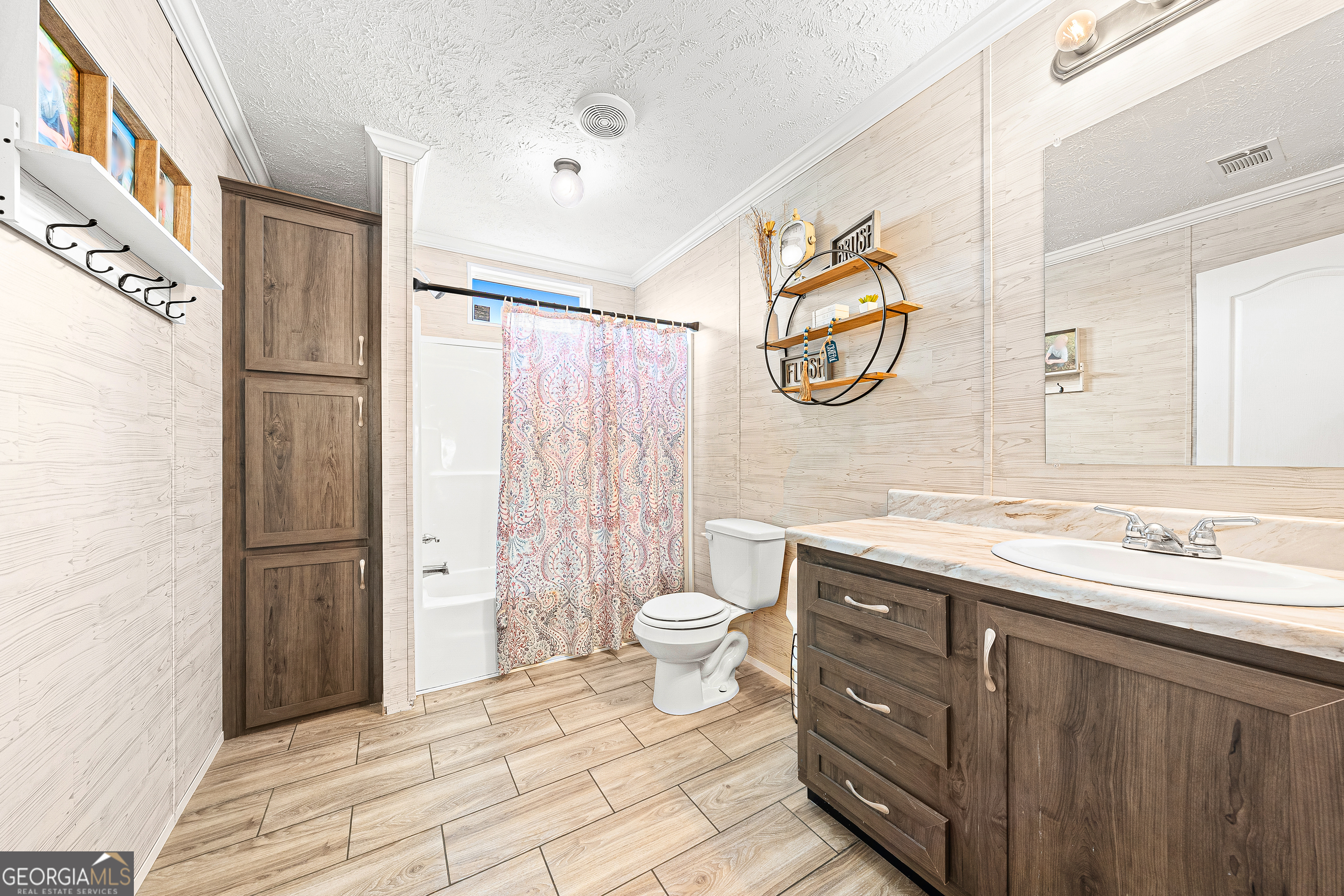 655 Lowe Road Comer, GA 30629 - Photo 15 of 19 a spacious bathroom with a granite countertop sink toilet and shower