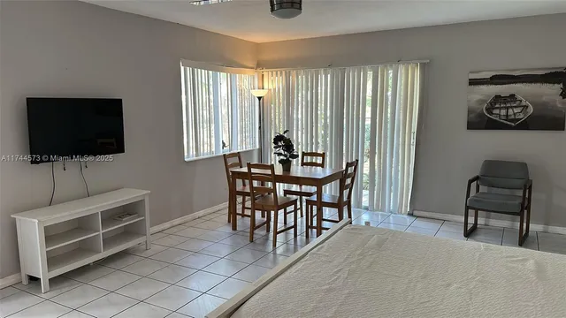 a view of a livingroom with furniture and window