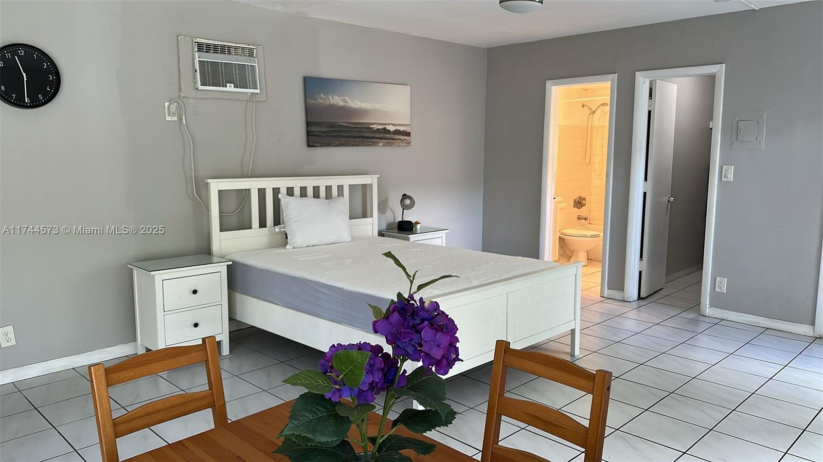 90 Isle Of Venice Drive, Unit 1 Fort Lauderdale, FL 33301 - Photo 5 of 7 a living room with furniture and a flat screen tv