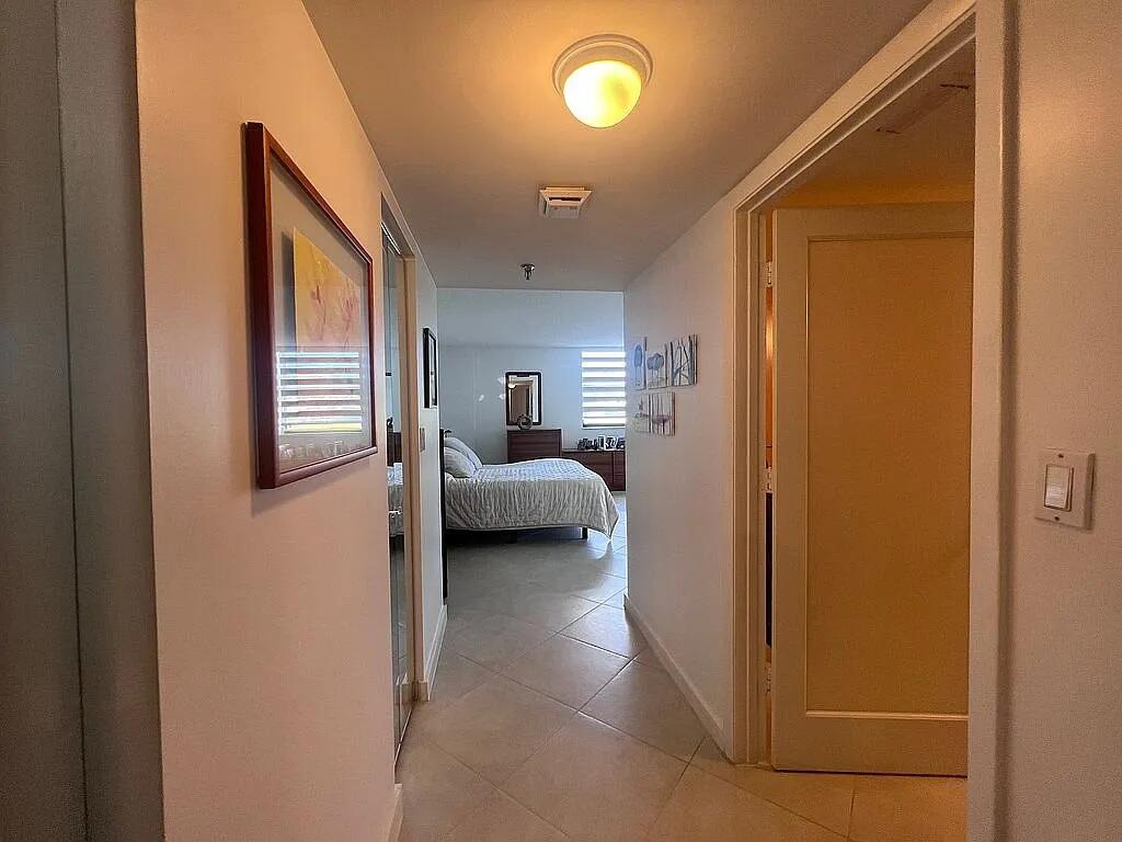 6463 La Costa Drive, Unit 105 Boca Raton, FL 33433 - Photo 30 of 40 a en suite bathroom with a toilet sink and shower