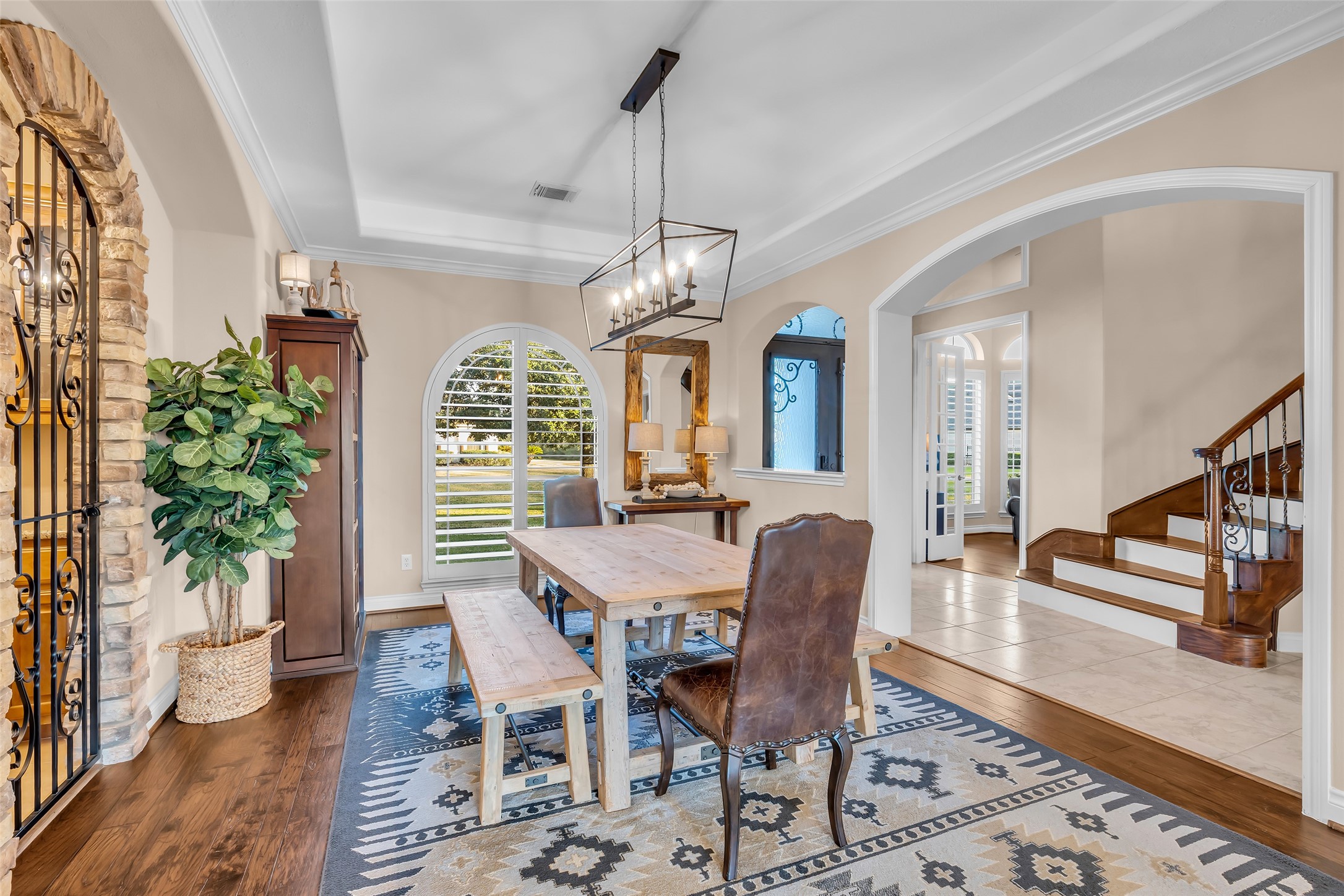 25603 Windy Isle Court Spring, TX 77389 - Photo 10 of 41 Large Dining Area w/wrought iron gate leading to bar area.