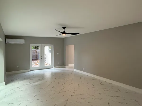 a view of an empty room with a window