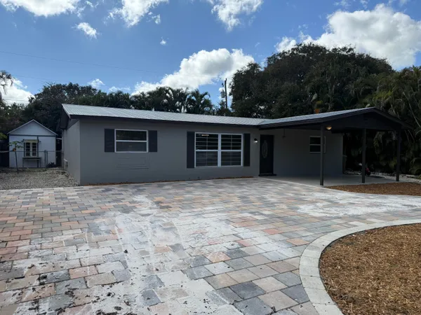 a house with trees in the background