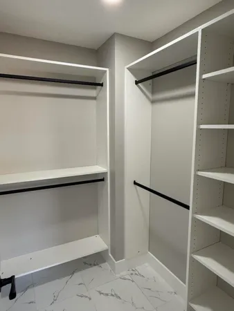 a view of an empty walk in closet
