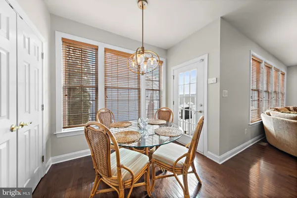 a dining room with furniture window wooden floor