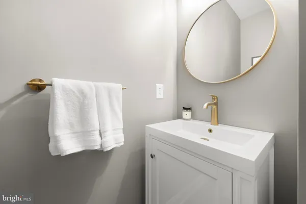 a bathroom with a sink and mirror