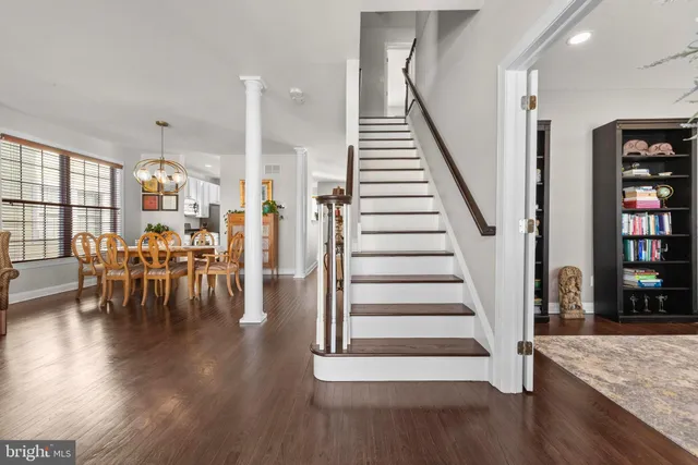 a view of dining room with furniture and wooden floor