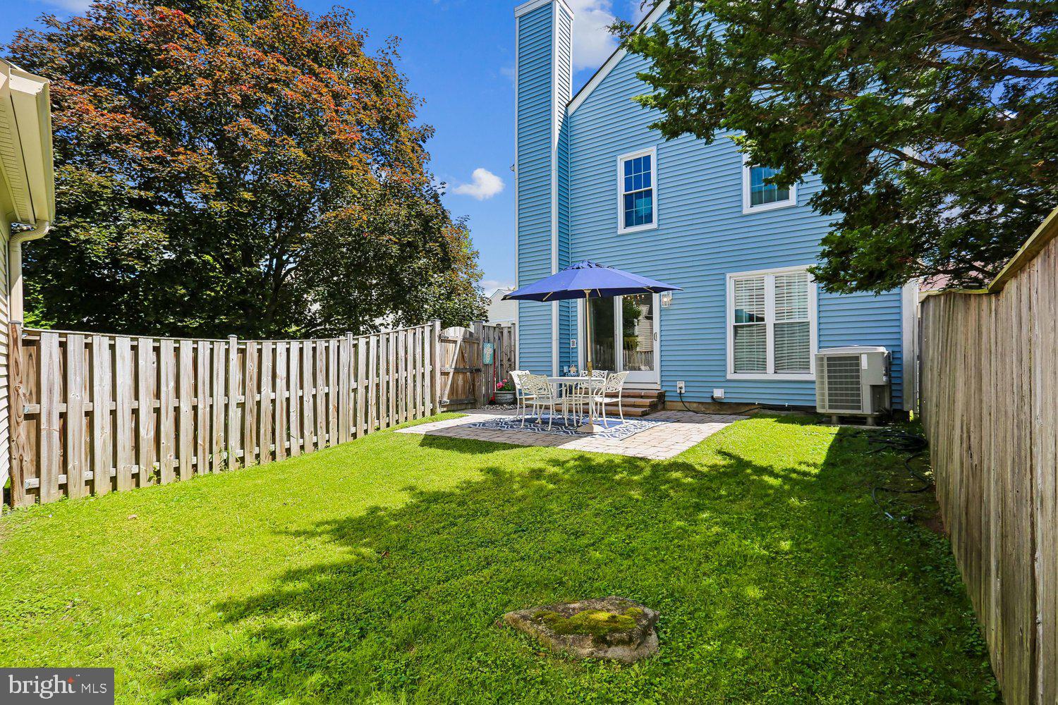 14822 Rose Trellis Place Silver Spring, MD 20906 - Photo 47 of 65 a view of a house with backyard and sitting area